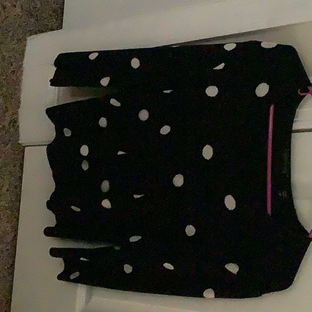 A Stylish Polka-dot Jacket with a matching Black beaded white polka-dot shirt.
